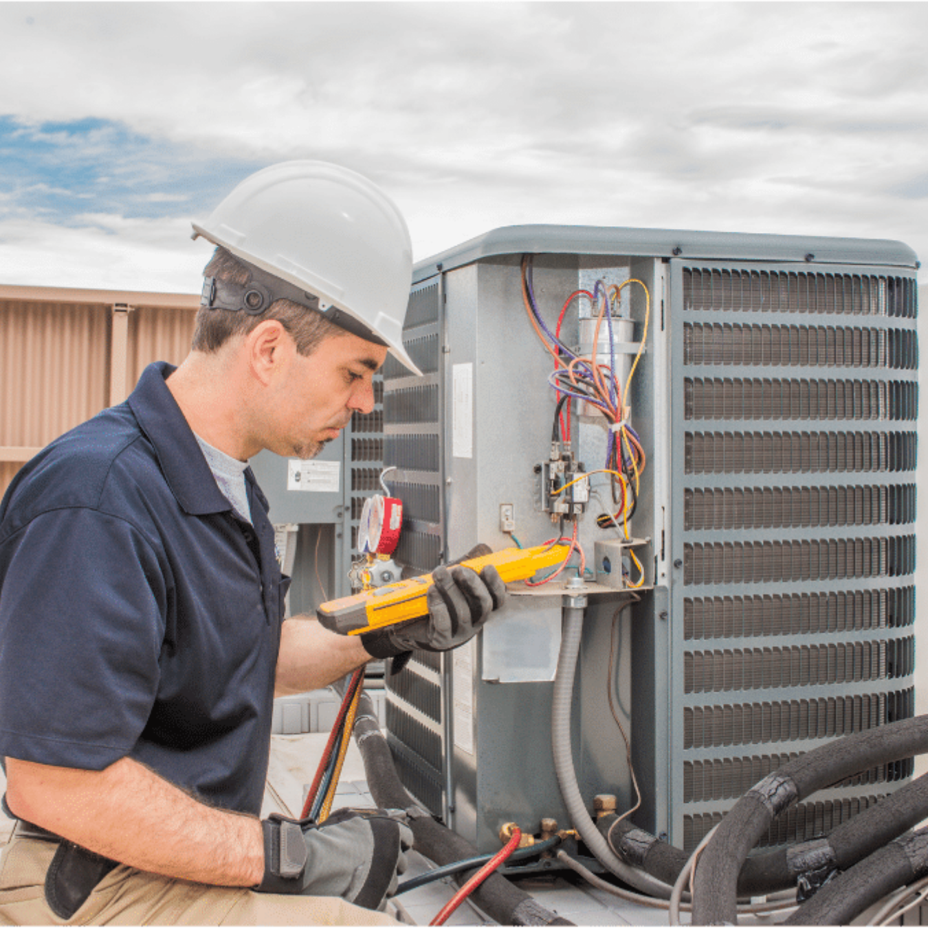 Whitby HVAC Pros HVAC technician servicing a system