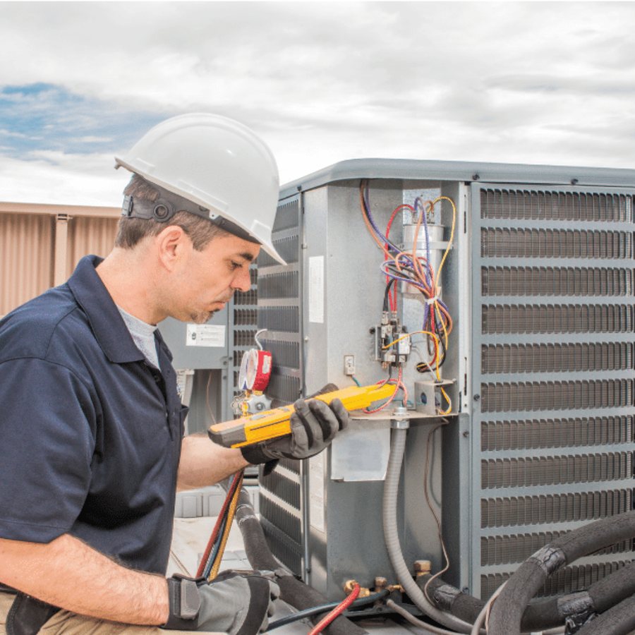 Whitby HVAC Pros HVAC technician servicing a system